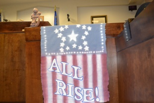 After every graduation, Judge Elliot says, "When one rises, we all rise."