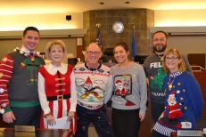 Judge Nancy Allf with the ugly sweater contest participants.