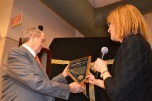 Judge Allan Earl gets award from Judge Jennifer Togliatti at his retirement.