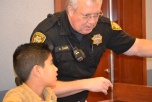 Marshal Bill Campbell teaches a young recruit the ropes of keeping a courtroom safe.