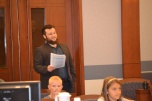 Mike Kamer with Project Real keeps an eye on student progress through the mock trial.